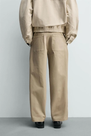 Брюки WIDE FIT со складками- Заказать в России