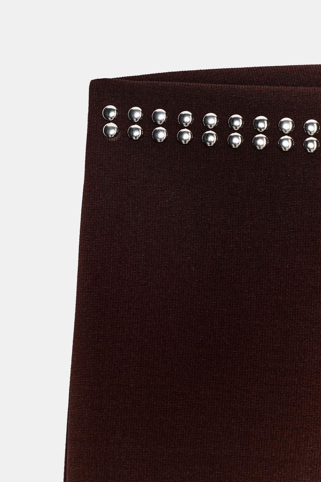 РАСКЛЕШЕННЫЕ БРЮКИ С ЗАКЛЕПКАМИ