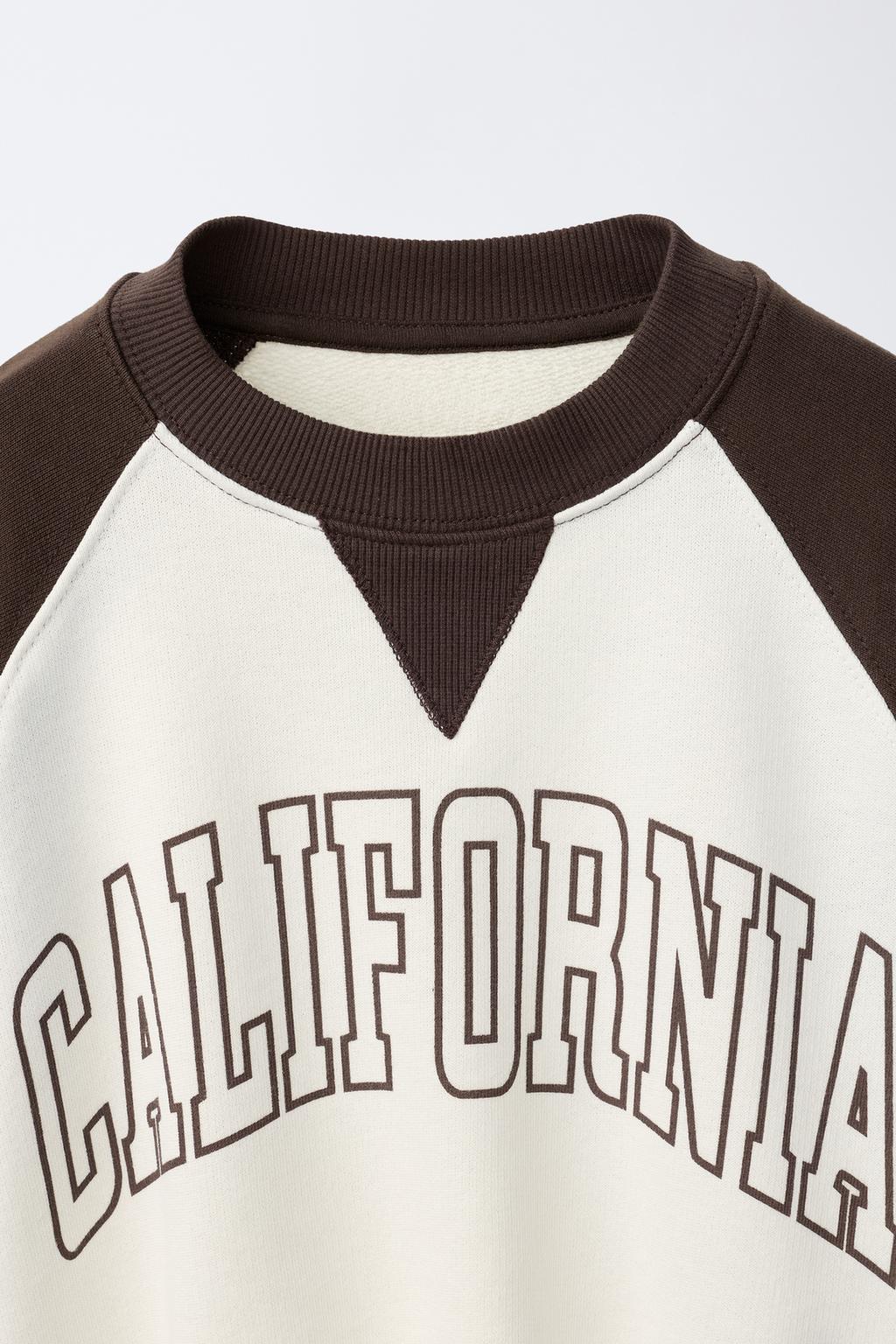 ТОЛСТОВКА С РУКАВАМИ РЕГЛАН И НАДПИСЬЮ