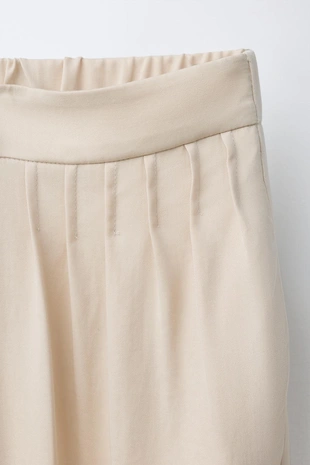 Брюки бомбачо с защипами- Заказать в России