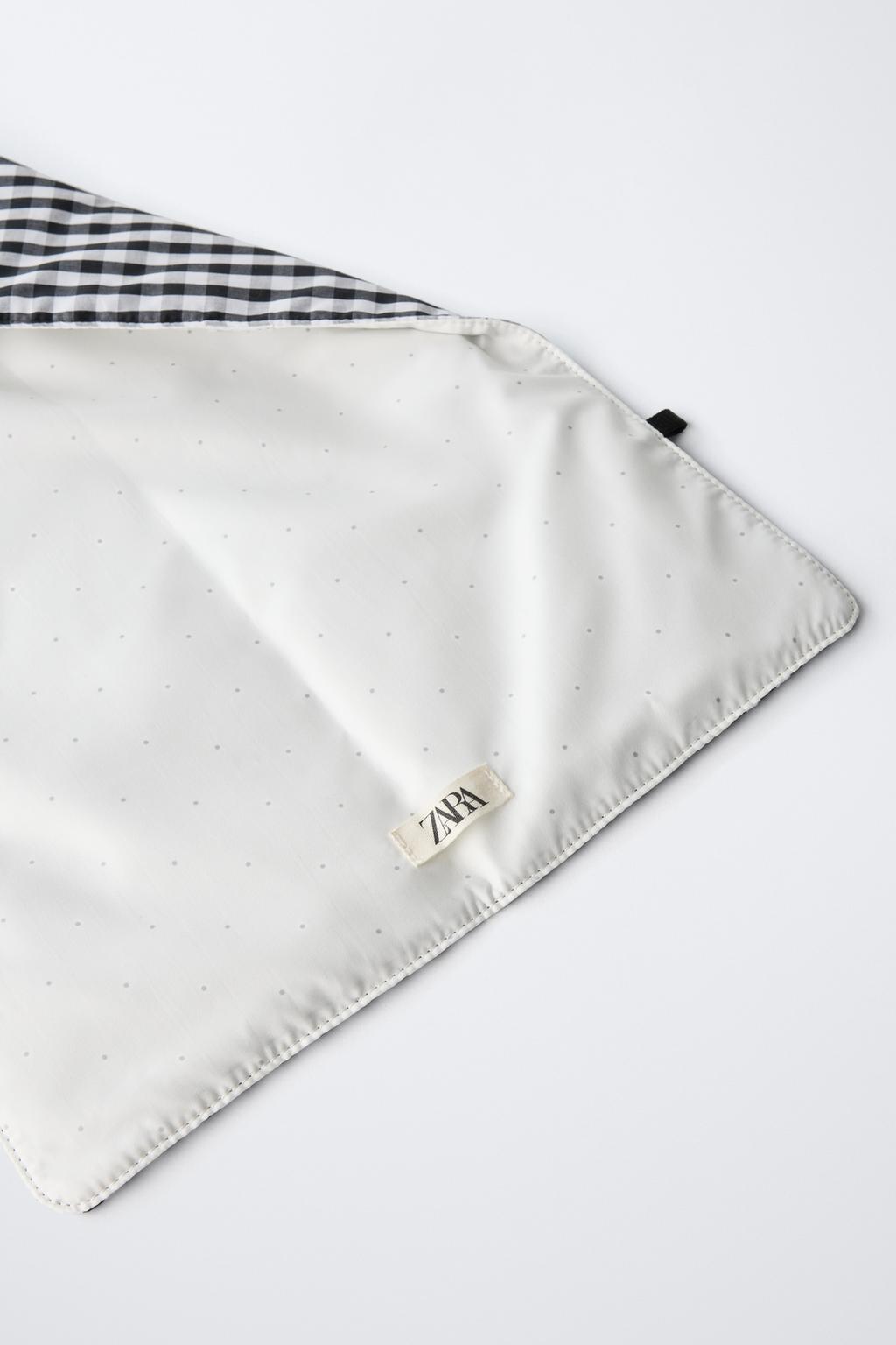 Подстилка для смены памперса с клетчатым принтом