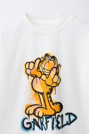 Футболка граффити GARFIELD © PAWS INC- Заказать в России