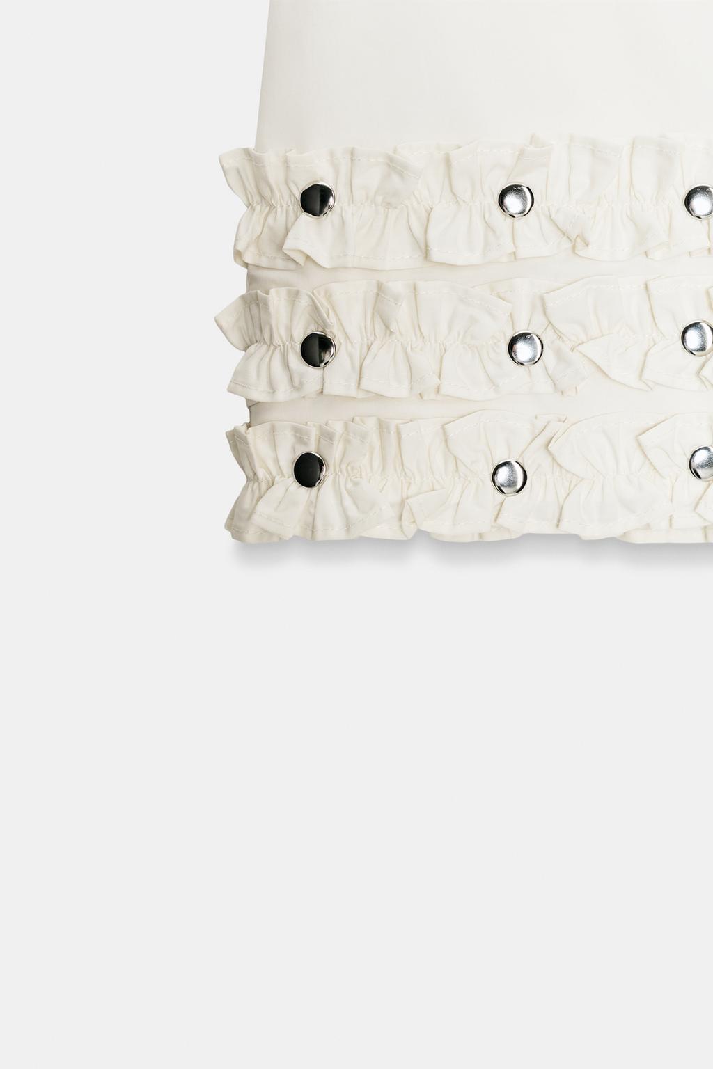 МИНИ-ЮБКА С ВОЛАНАМИ И ЗАКЛЕПКАМИ