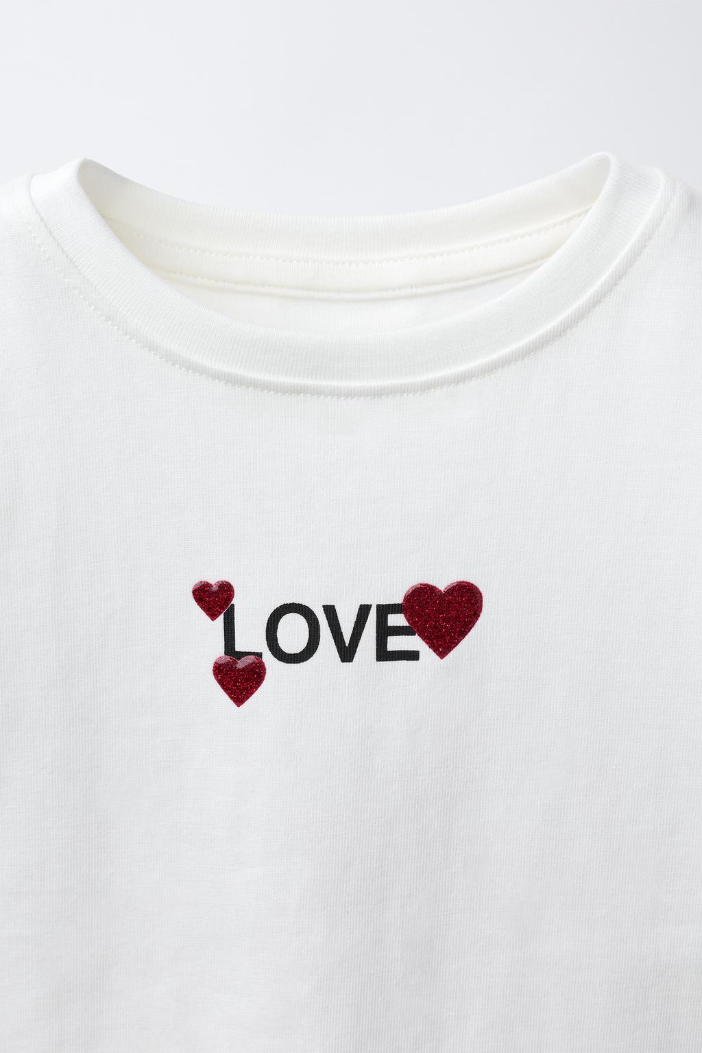 Футболка с блестящим принтом и резиновым покрытием