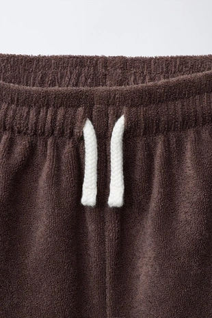 Шорты-бермуды из махровой ткани с этикеткой- Заказать в России