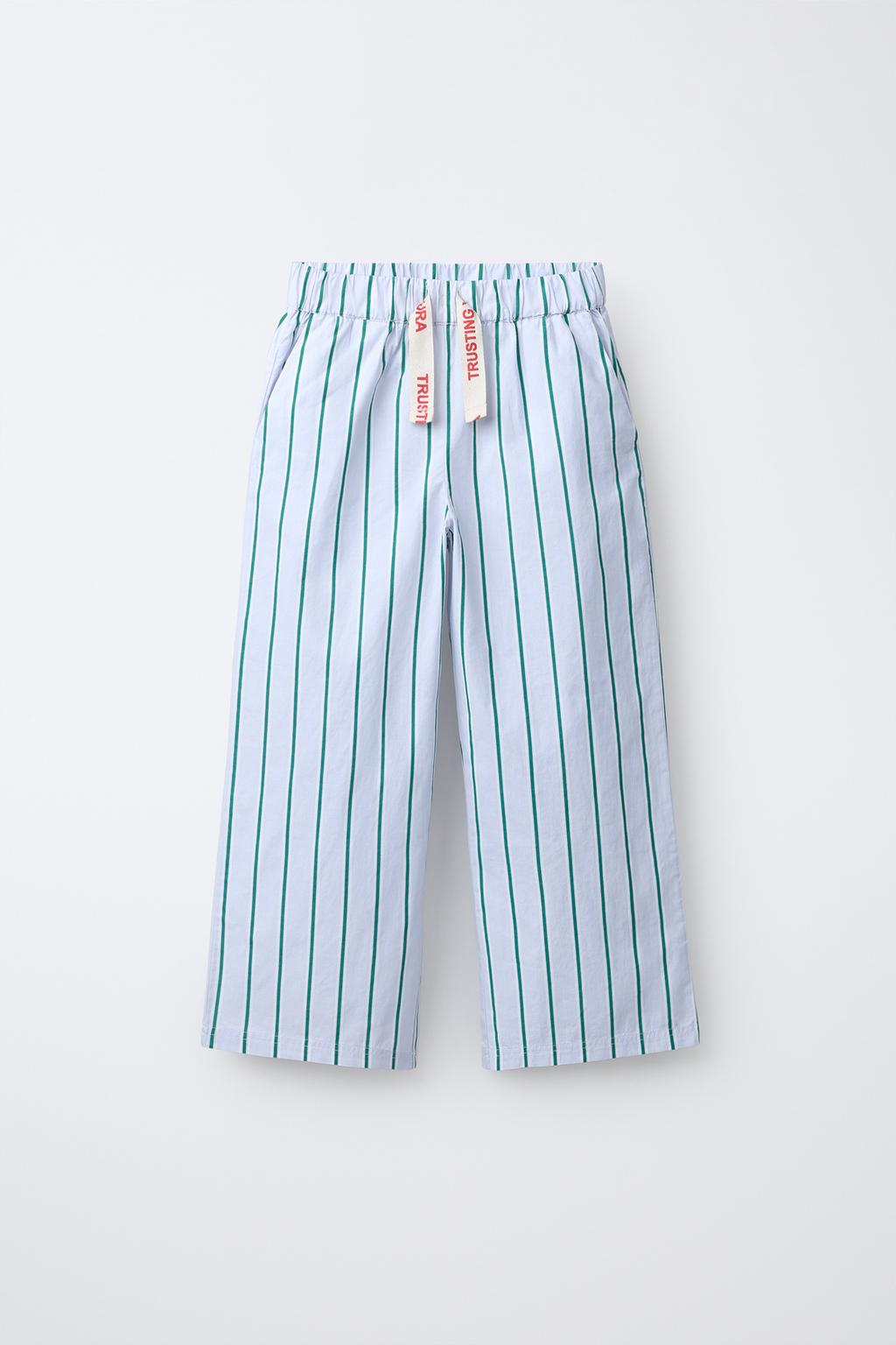 БРЮКИ В ПОЛОСКУ С ПРИНТОМ