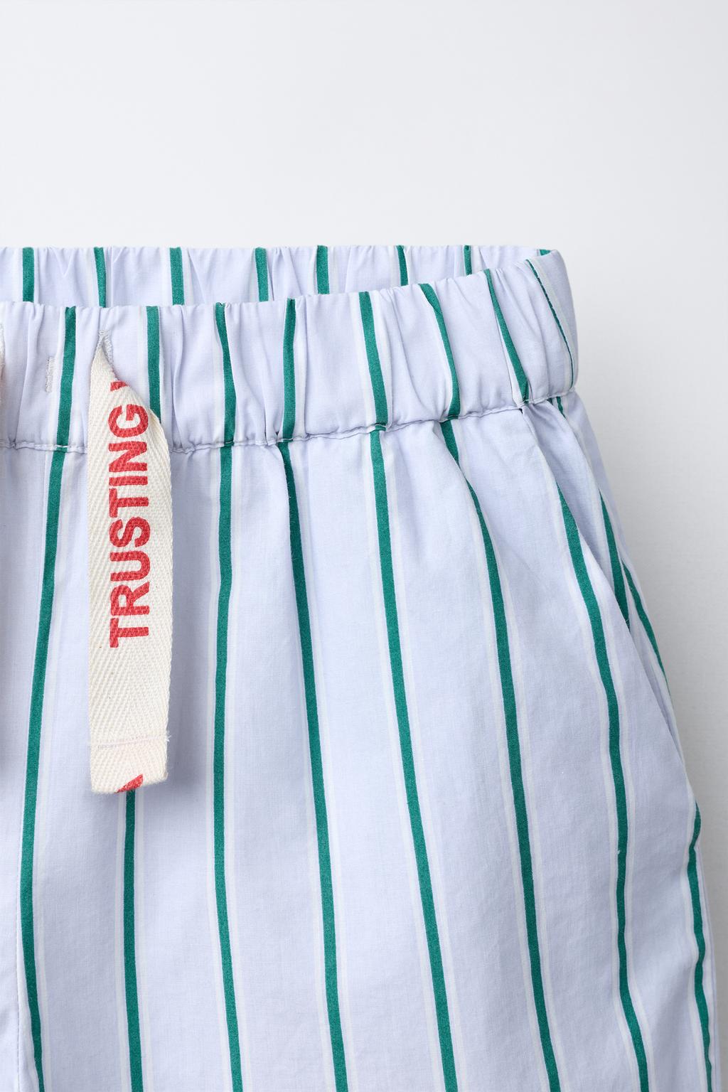 БРЮКИ В ПОЛОСКУ С ПРИНТОМ