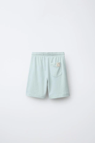 Комплект из футболки поло и шортов-бермуд из рельефной ткани- Заказать в России