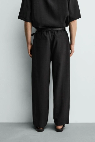 Брюки свободного кроя со складками- Заказать в России