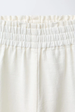 Брюки-кюлоты из хлопка и льна с вышивкой в виде цветов- Заказать в России