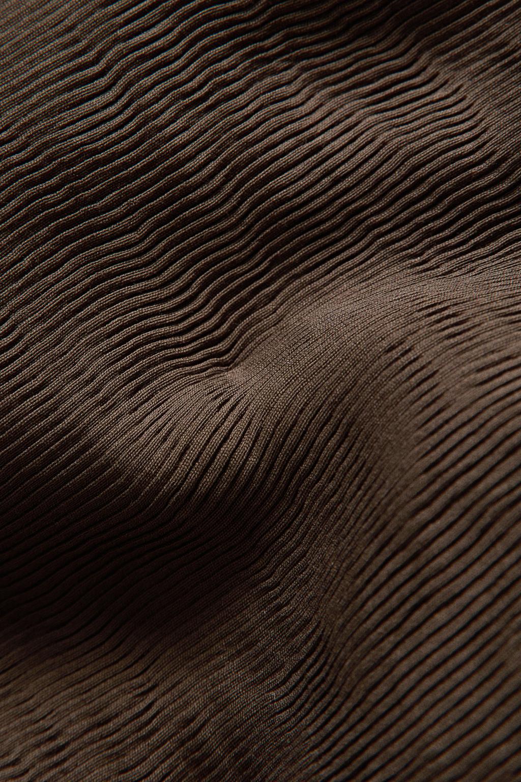 Стёганный покрывало foot of the bed с мягкими складками