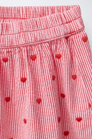 Брюки-баллон в клетку с вышивкой в виде сердец- Заказать в России