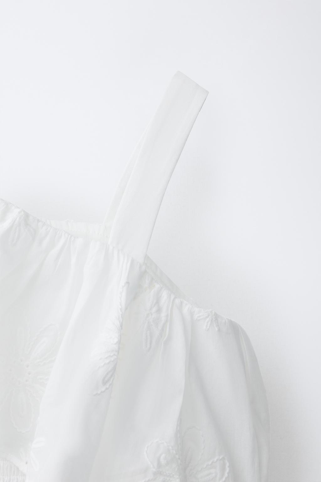 ТОП С АСИММЕТРИЧНЫМ ВОЛАНОМ