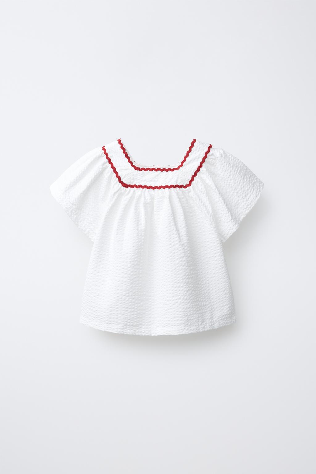 ТОП ИЗ ТЕКСТУРНОЙ ТКАНИ С ВОЛНИСТЫМ КРАЕМ