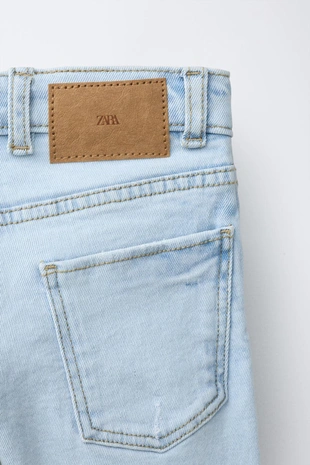 Джинсы  прямого кроя с разрезами- Заказать в России