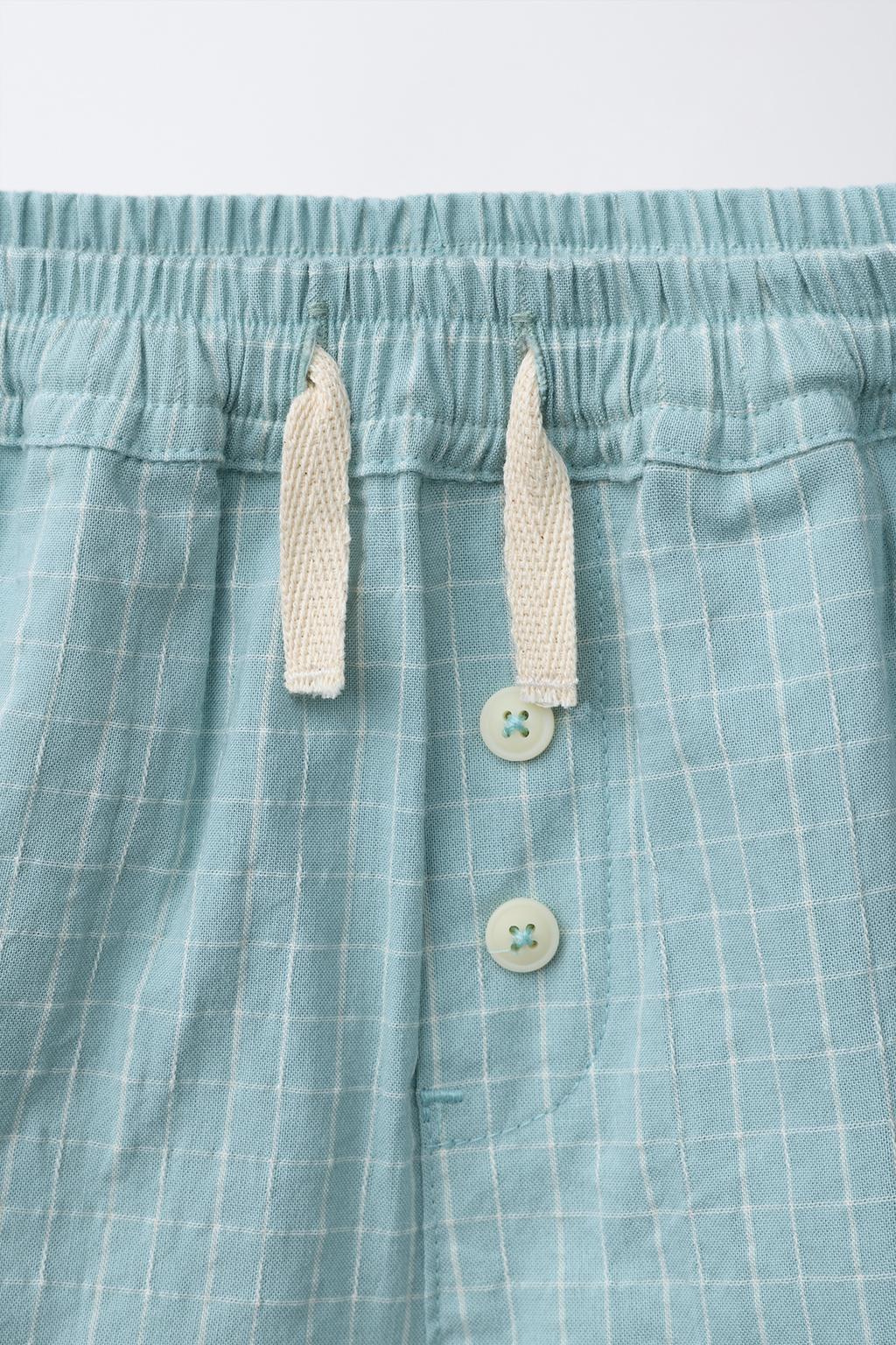 ШОРТЫ В КЛЕТКУ НА ПУГОВИЦАХ