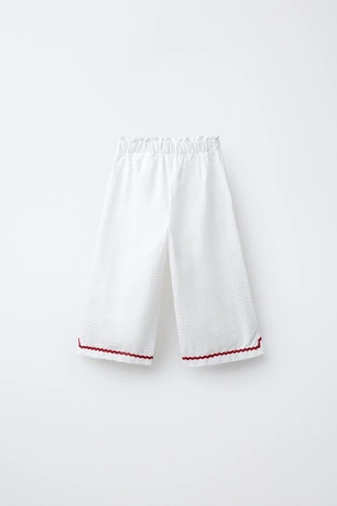 Брюки-кюлоты из рельефной ткани с контрастными волнистыми краями- Заказать в России