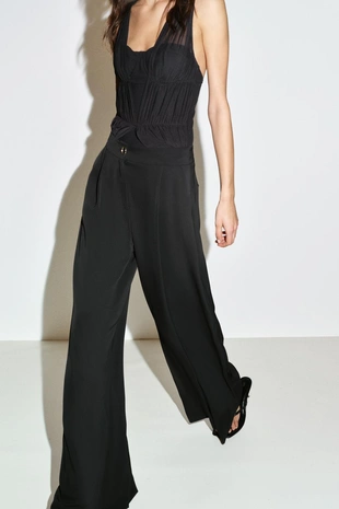 Брюки-палаццо с золотистой пуговицей- Заказать в России