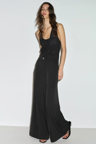 Брюки-палаццо с золотистой пуговицей- Заказать в России