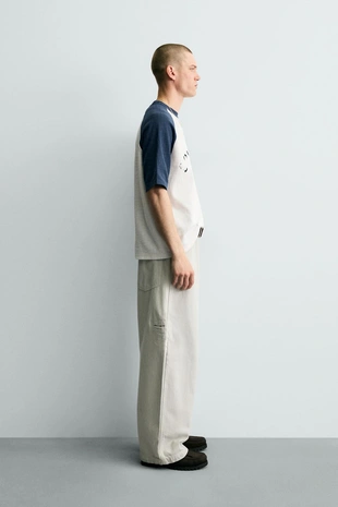 Трикотажная футболка колор-блок с принтом- Заказать в России