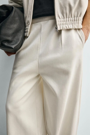 Брюки-джоггеры свободного кроя со складками- Заказать в России