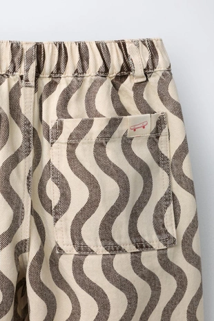 Джинсы с геометрическим принтом- Заказать в России