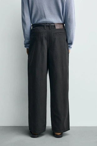 Брюки свободного кроя со складками- Заказать в России