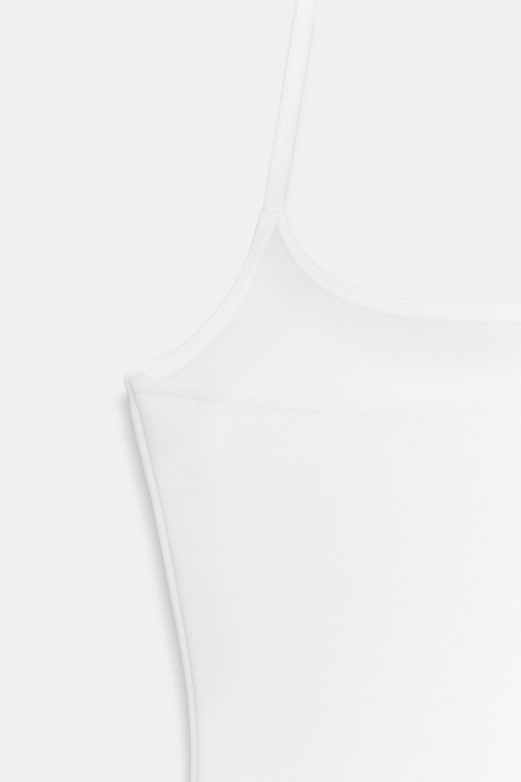 ЭЛАСТИЧНЫЙ ТОП С ГОРЛОВИНОЙ ХАЛТЕР