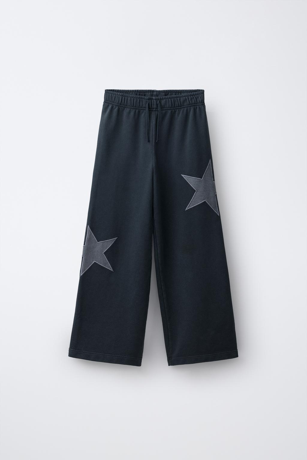 БРЮКИ ИЗ МЯГКОЙ ТКАНИ  С ЭФФЕКТОМ ПОТЕРТОСТИ И ЗВЕЗДАМИ