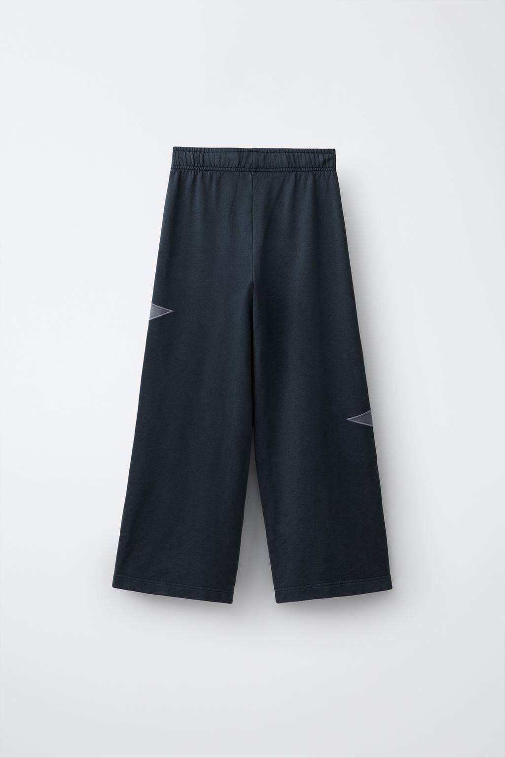 БРЮКИ ИЗ МЯГКОЙ ТКАНИ  С ЭФФЕКТОМ ПОТЕРТОСТИ И ЗВЕЗДАМИ