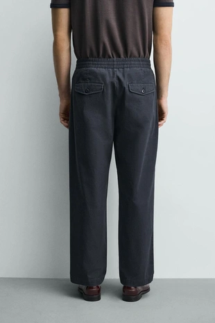 Брюки  с эффектом потертости- Заказать в России