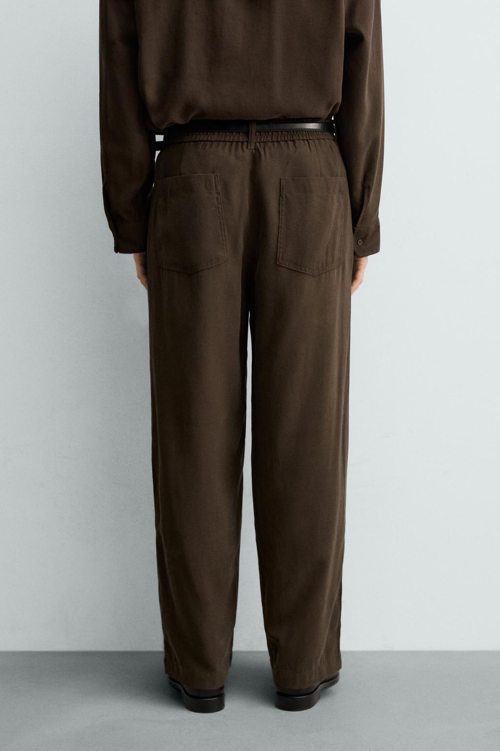 БРЮКИ  ИЗ СТРУЯЩЕЙСЯ ТКАНИ