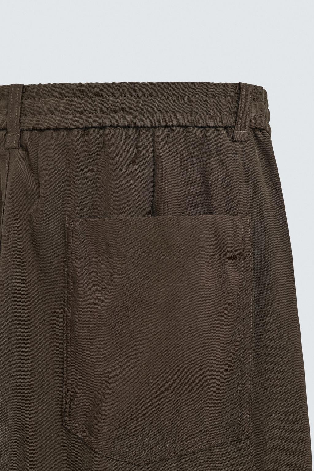 БРЮКИ  ИЗ СТРУЯЩЕЙСЯ ТКАНИ