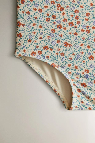 Детский купальник с цветочными оборками для пляжа- Заказать в России