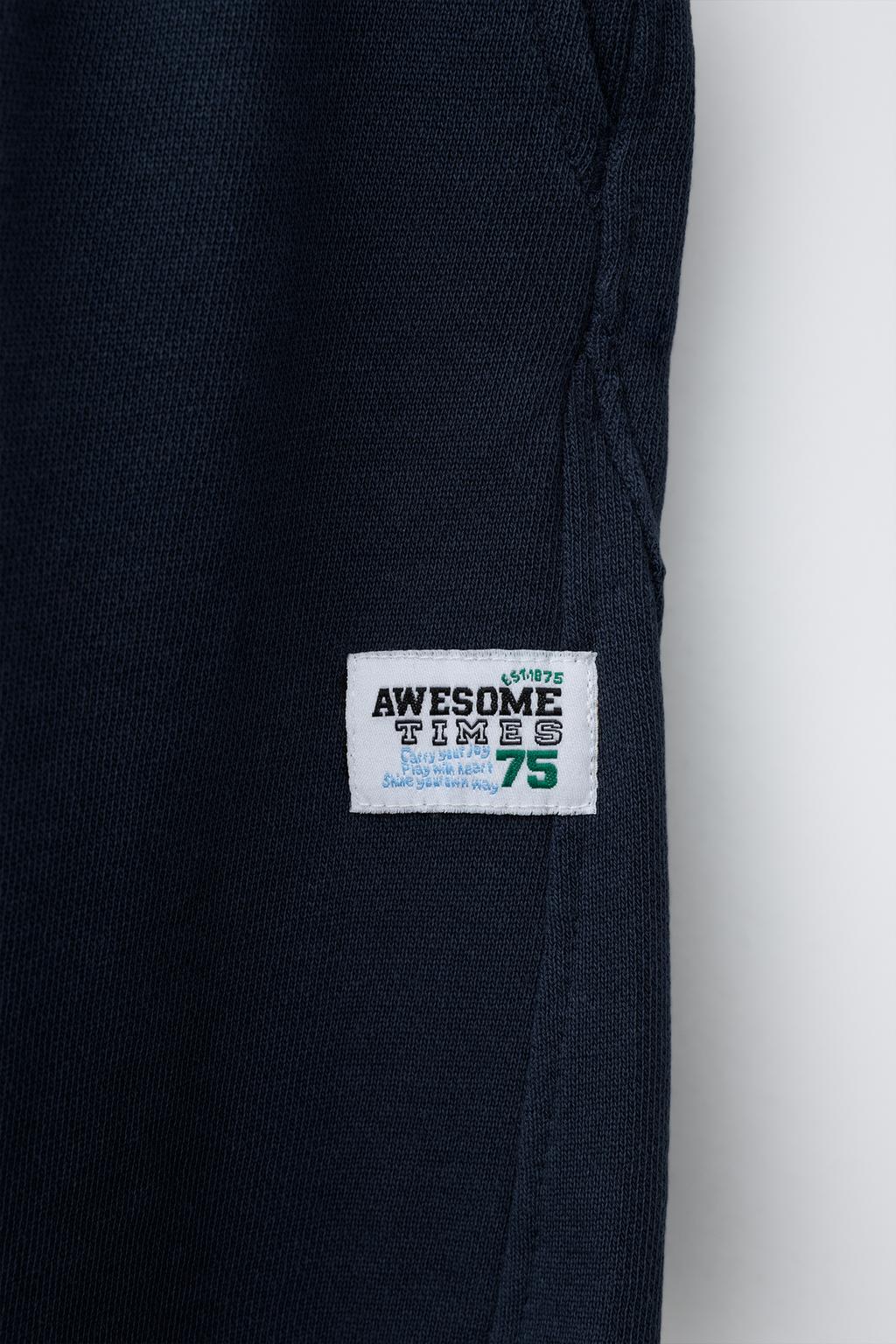 БРЮКИ  С ЭТИКЕТКОЙ