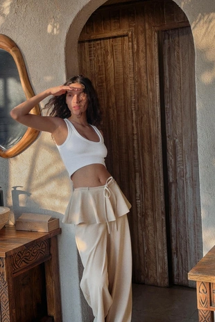 Брюки с широкими штанинами и оборочками на поясе- Заказать в России