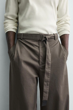 Брюки свободного кроя с поясом- Заказать в России