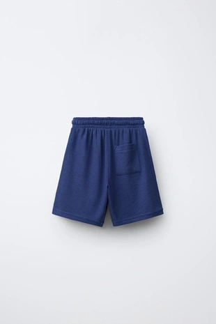 Комплект из футболки и шортов вафельного плетения с нашивкой- Заказать в России