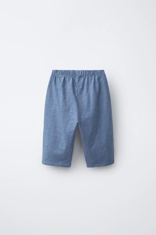 Брюки комбинированной текстуры- Заказать в России