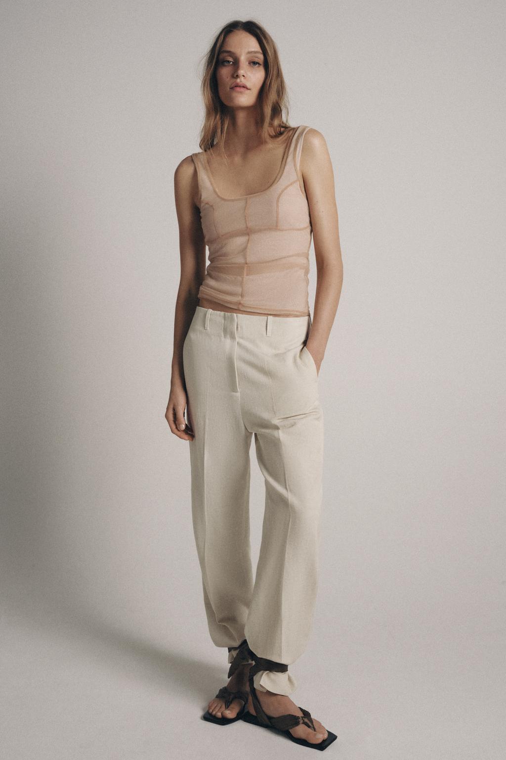 ТОП ИЗ ПОЛУПРОЗРАЧНОЙ ТКАНИ С ДЕКОРАТИВНОЙ СТРОЧКОЙ