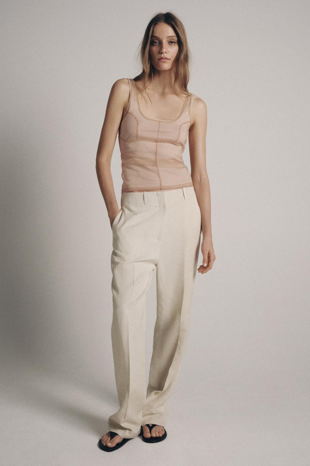 ТОП ИЗ ПОЛУПРОЗРАЧНОЙ ТКАНИ С ДЕКОРАТИВНОЙ СТРОЧКОЙ