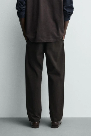 Широкие брюки со свободным кроем и складками- Заказать в России