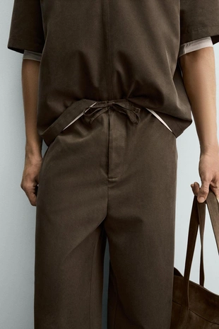 Широкие брюки-палаццо из текстильной смеси с эластичным поясом- Заказать в России