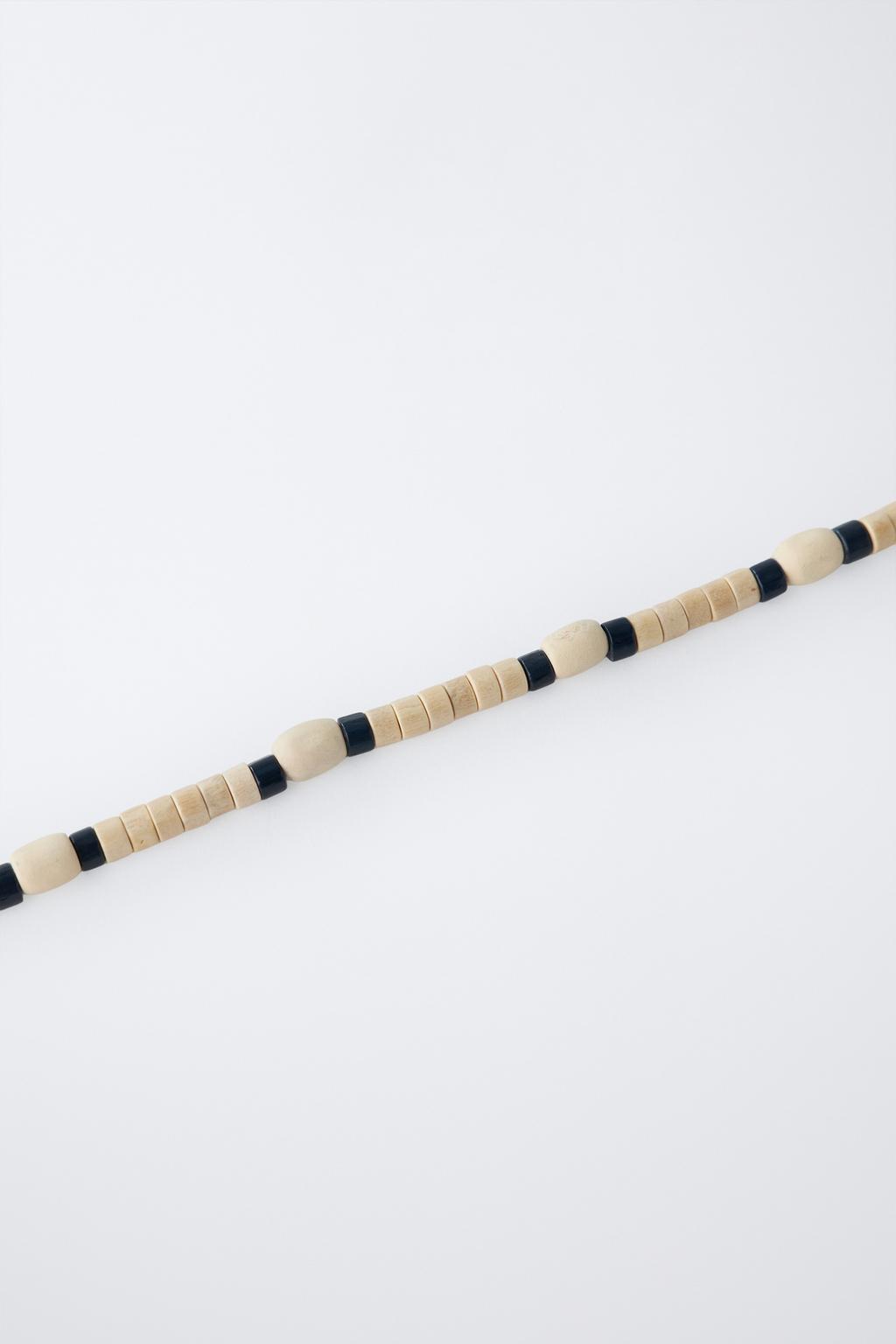 Набор из двух оплетенных веревкой и деревянных бусин ожерелий