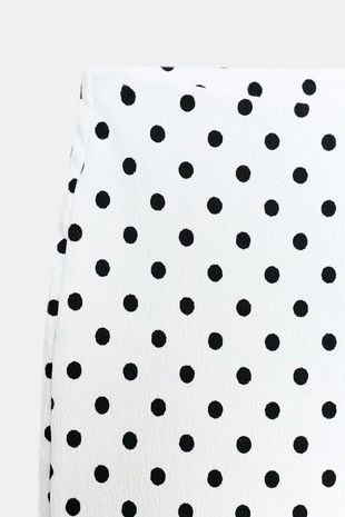 Расклешенные брюки стретч в горошек