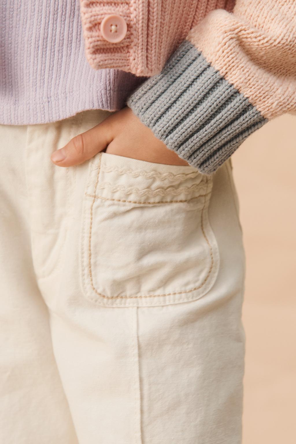 Брюки limited edition с расклешенными штанинами и контрастной строчкой