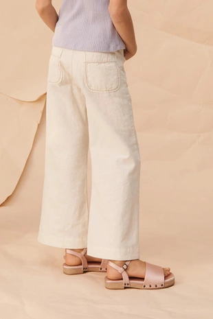 Брюки limited edition с расклешенными штанинами и контрастной строчкой- Заказать в России