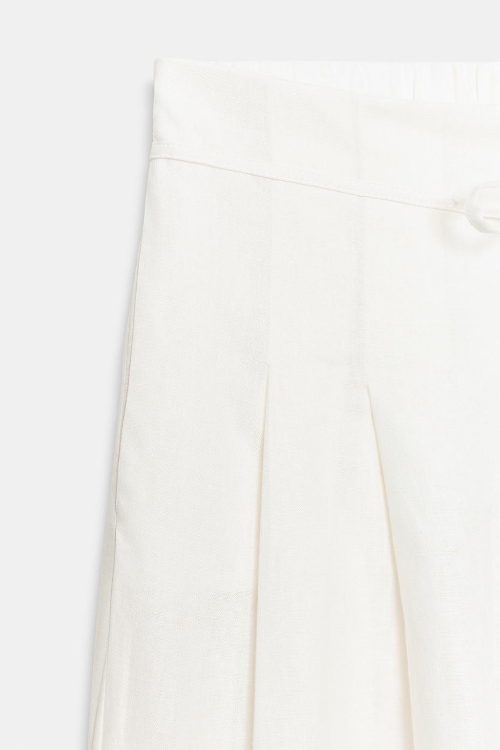 Широкие брюки с защипами