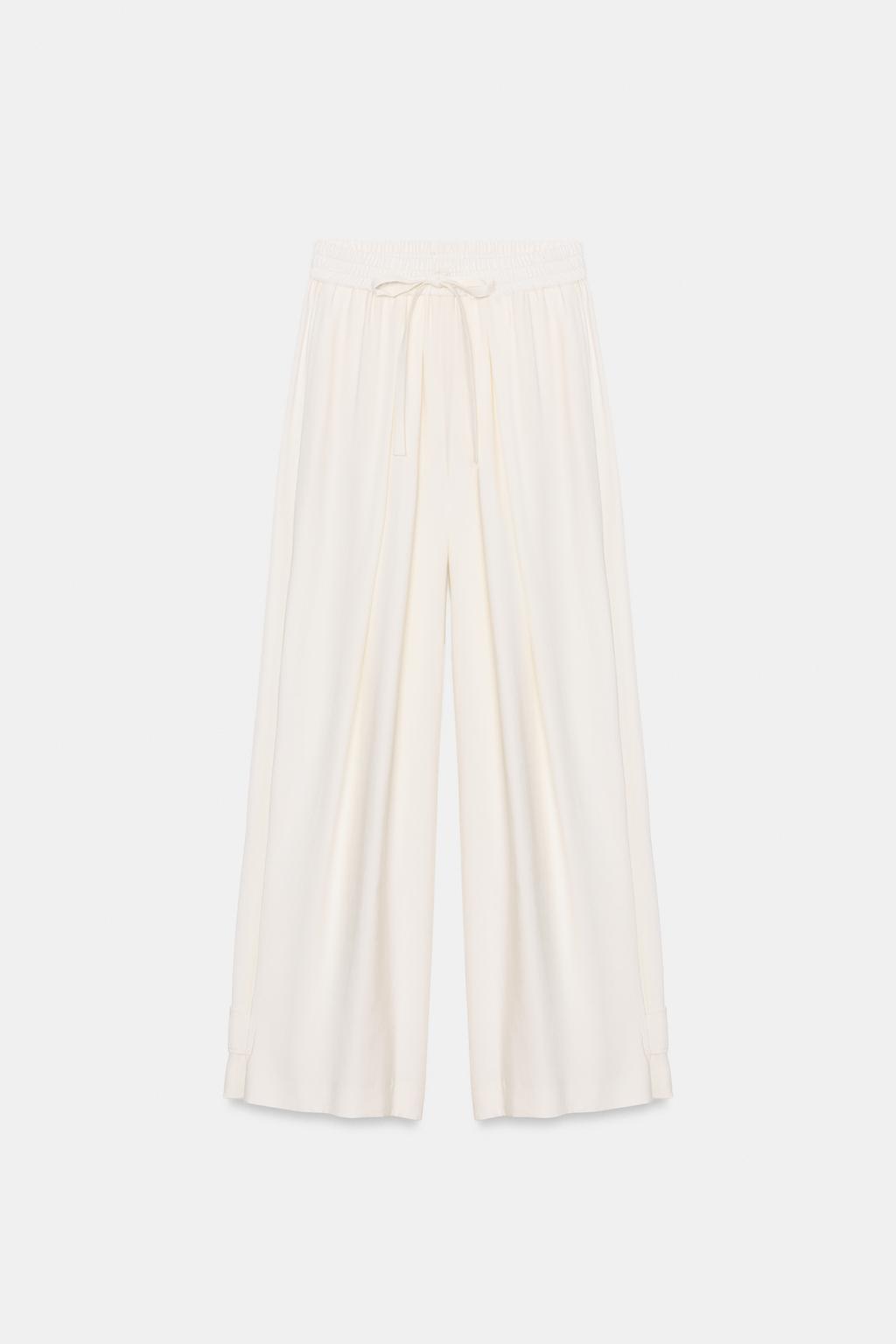 БРЮКИ СВОБОДНОГО КРОЯ С РЕГУЛИРУЕМЫМИ МАНЖЕТАМИ