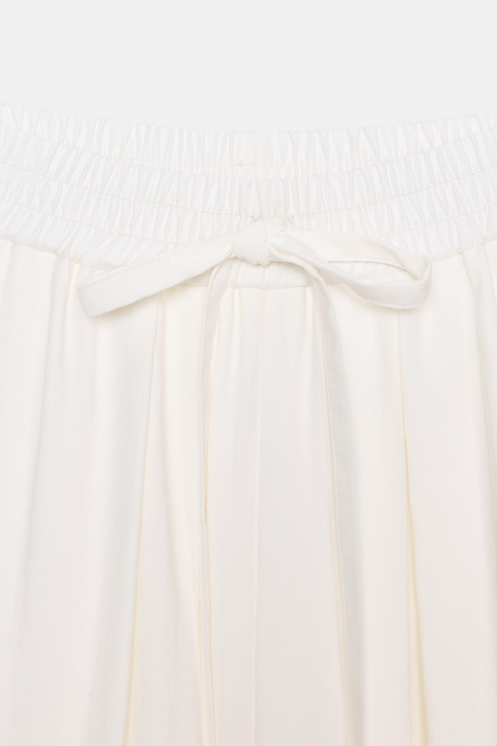 БРЮКИ СВОБОДНОГО КРОЯ С РЕГУЛИРУЕМЫМИ МАНЖЕТАМИ